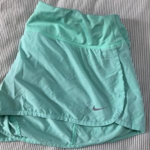 Mint green Nike running shorts